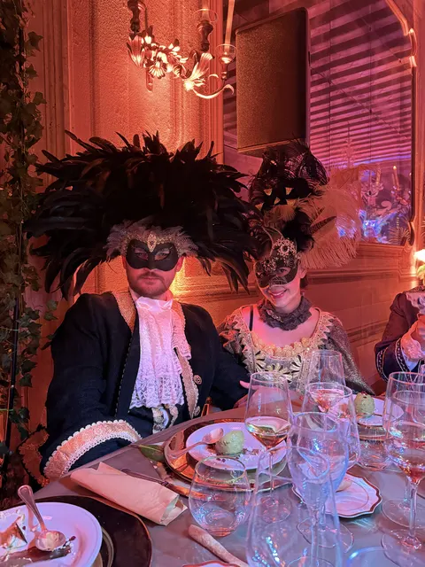 Nate and Angie dressed for a masquerade dinner